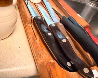 Kitchen knives, wood cutting boards, stoneware crock