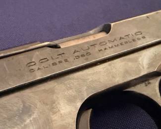 Colt Automatic 380 Hammerless pistol maker's mark closeup