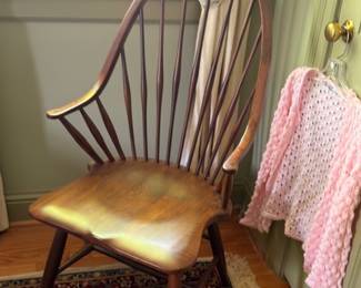 Windsor spindle back wooden chair with crocheted pink throw blanket