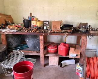 Garage lot gas cans chicken wire extension cord and wire shelving