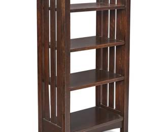 1126 An L. & J. G. Stickley Onondaga magazine stand 1906-1912; Fayetteville, NY With partial red label: L. & J.G. STICKLEY / HANDCRAFT With four tiers and slatted sides 40.25" H x 21" W x 12" D Estimate: $800 - $1,200
