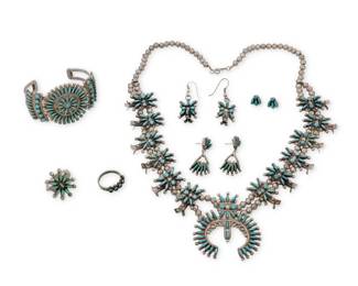 1331 A group of Southwest Zuni needlepoint jewelry Mid/late 20th century Four with unidentified etched mark; cuff further stamped: W Hooee / Zuni / NM Five works comprising a delicate needlepoint turquoise squash blossom necklace with twelve blossoms and a central elaborate naja, together with a pair of matching blossom earrings, as well as a two-wire cuff bracelet with central round plaque, two rings, including one with cluster set needlepoint turquoise, and two further pairs of earrings, one pair with dangles, and the other a pair of diminutive studs 10 pieces Necklace: 23.5" L x 2.25" H; cuff: 6.25" total inner C x 1.625" H, gap: 1.25"; Ring sizes: 9 & 8; Earrings: 2" H; 1.5" H; 0.375" H 158.8 grams gross Estimate: $800 - $1,200