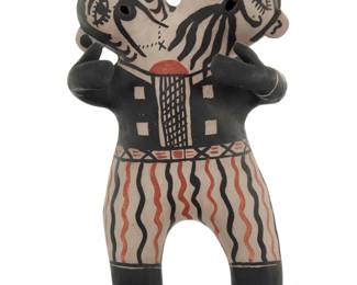 1149 Mary Janice Ortiz (b. 1954, Cochiti Pueblo) A polychrome pottery double headed figure, late 20th/early 21st century Partial indecipherable marks to underside of feet Decorated in black and orange on a cream slip ground 9.75" H x 5.375" W x 4.25" D Estimate: $600 - $800