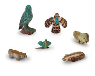 1359 Six Zuni carved stone fetish animals Mid/late 20th century, mostly Zuni Pueblo Most variously incised with signature, initials, or artist's cipher From artists including Fred Bowannie, comprising one carved from shell and five hardstone, four with turquoise or coral inset eyes, two mounted with offerings 6 pieces Largest: 3.625" H x 2" W x 1.375" D; Smallest: 1.125" H x 1.875" W x 0.75" D Estimate: $300 - $500