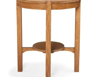 1296 A Gustav Stickley style oak lamp table Early 20th century Stamped to underside: DUNGAN & FRY / ALLENTOWN, PA In the style of Gustav Stickley lamp table no. 137, with circular undertier above an X-stretcher 30" H x 24.25" Dia. Estimate: $600 - $800