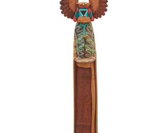 1201 Neil Randall David Sr. (b. 1944, Hopi-Tewa) A painted carved cottonwood 'Crow Mother' katsina, 1987 Signed with artist's initials, dated, and titled to underside: © 87 [Hanvantewa], depicted holding a basket with corn 27.5" H x 6.75" W x 5.25" D Estimate: $400 - $600