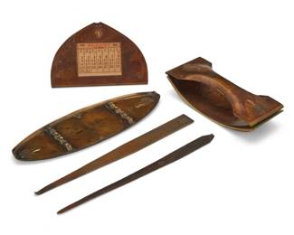 1182 A group of Roycroft hammered copper desk articles Early 20th century Each with impressed Roycroft orb Comprising a letter opener, blotter, calendar, and pen tray, together with an unmarked copper letter opener 5 pieces Blotter: 1.875" H x 6.125" W x 2.625" D; Calendar: 3.75" H x 5.5" W x 1.5" D; Tray: 8.625" L Estimate: $400 - $600