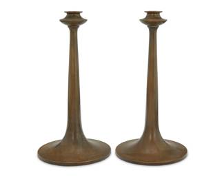 1256 A pair of Bradley & Hubbard brass candlesticks Early 20th century Each applied with metal tag: BRADLEY & HUBBARD / [lamp cipher] / MFG. CO. 2 pieces Each: 12" H x 6.25" Dia. Estimate: $300 - $500