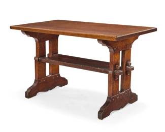 1074 A Gustav Stickley oak library table, no. 401 Circa 1902 Unmarked The table raised on trestle supports, joined by a plank stretcher with keyed tenon joinery 28.75" H x 48.25" W x 28" D Estimate: $1,000 - $1,500