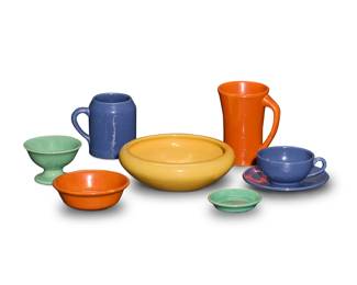 1272 A collection of Bauer glazed pottery table items Circa 1930s Each unmarked Comprising: 8 dinner plates 7 partitioned plates 7 salad plates 7 bread & butter plates 3 serving plates 3 large bowls 13 bowls of various sizes 10 small dishes 9 mugs of various sizes 3 espresso mugs 3 footed fruit bowls 7 cups 7 saucers 87 pieces Largest plate: 12.625" Dia.; Tallest mug: 5.75" H; Large bowls: 2.625" H x 8.375" Dia. Estimate: $400 - $600