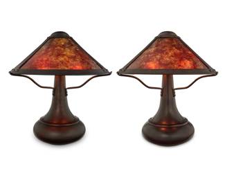 1227 A pair of Mica Lamp Co. table lamps Early 21st century Each with impressed factory marks; one with applied label: MICA LAMP CO. / Glendale, CA / SOLID COPPER Each patinated copper base issuing three lights, surmounted by a copper and mica shade, electrified 2 pieces Each overall: 19.25" H x 17.25" Dia. Estimate: $600 - $800