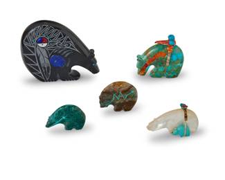 1358 Five Zuni carved stone fetish medicine bears Mid/late 20th century, mostly Zuni Pueblo Most variously incised with signature, initials, or artist's cipher From artists including Paulette Quam, Stewart Quandelacy, and Hiram Peynestas, comprising one carved from shell, four carved from hardstone, three with turquoise or coral heartlines, each with inset turquoise or coral eyes or accents, two mounted with offerings 5 pieces Largest (Hiram): 3.125" H x 3.875" W x 0.875" D; Smallest: 1.25" H x 1.875" W x 0.375" D Estimate: $300 - $500