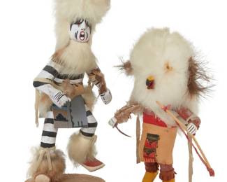 1214 Two Hopi painted carved cottonwood katsinas Two works:  Virgil Long (b. 20th century, Hopi-Tewa) A Koshare 'Clown' katsina, early 21st century Titled and signed to underside: by: Long Mounted with fur, hide, and feathers 10.75" H x 4.5" W x 3.75" D  An 'Owl' katsina, early 21st century Inscribed to underside: Owl Mounted with fur, hide, and feathers 7.75" H x 5" W x 3.375" D  2 pieces Tallest: 11" H x 4" W Estimate: $200 - $300