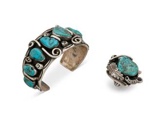 1344 A set of Jimmy Victor Begay Navajo sterling silver and turquoise jewelry Jimmy Victor Begay (b. 20th century, Diné) Mid/late 20th century Each marked: JVB Comprising a chunky tapered cuff bracelet with six graduated set nugget turquoise, with silver feather and silver wire overlay accents, as well as a similar design chunky silver ring 2 pieces Cuff: 6.875" total inner C x 1.5" H, gap: 1.25"; Ring size: 10.75 127.6 grams gross Estimate: $700 - $900