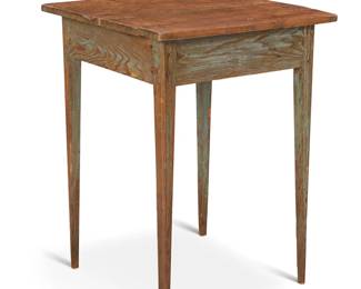 1310 A rustic painted wood table Early 20th century Raised on attenuated legs 28" H x 21" W x 20.5" D Estimate: $300 - $500