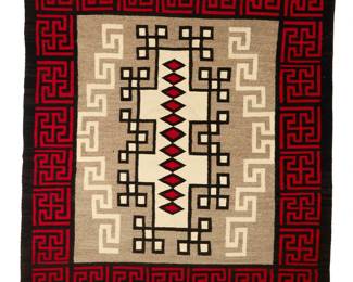 1215 A Navajo Crystal rug Early 20th century, Diné Woven in red, black, cream, and natural grey wool, centered by stacked diamonds within a cluster of interlocking squares and meandering motifs, within an intricate whirling log border 86.5" H x 76" W Estimate: $1,000 - $1,500