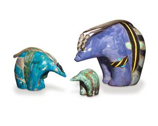 1393 Three glazed pottery fetish bears Late 20th century The smallest with incised initial and date: SMB / 5/96 Two depicted with medicine/offering wrap and mounted with horse hair 3 pieces Largest: 12.25" H x 16.5" W x 8.75" D; Smallest: 4.5" H x 5.625" W x 3.875" D Estimate: $400 - $600