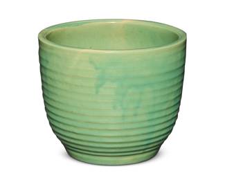 1275 A Bauer green glazed pottery ringware planter Circa 1930s Incised to underside: 10 10.25" H x 12.375" Dia. Estimate: $200 - $300