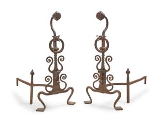 1277 A pair of monumental enameled wrought iron andirons 20th century Each with scrollwork, twisted standard, and a braided ring 2 pieces Each front: 55" H x 26.5" W x 13" D; Each bracket: 21.5" H x 12" W x 50" D Estimate: $800 - $1,200