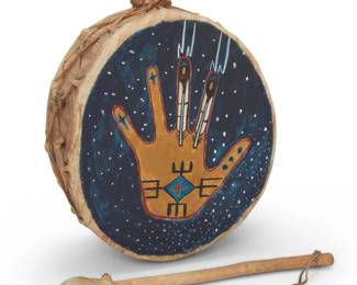 1317 Sonya Holy Eagle (b. 20th century, Lakota) A painted hide drum, 1997 Signed and dated on reverse An oval drum with a painted yellow hand surrounded by blue, and with feathers, thunderbolts, and other spiritual motifs, on stretched hide over a wood base, with braided hide handle to top, and with a stick beater 2 pieces 15" H (with handle) x 10" W x 5.5" D; stick: 13" L Estimate: $200 - $400