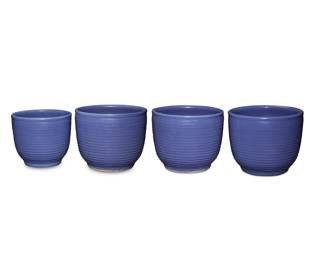 1013 Four Bauer blue glazed pottery ringware planters Circa 1930s Each unmarked 4 pieces Three: 13.125" H x 16.375" Dia.; One smaller: 12.25" H x 14.125" Dia. Estimate: $600 - $800