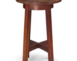 1127 An L. & J. G. Stickley drink stand, no. 22 Circa 1910 Unmarked The legs joined by a shaped X-stretcher 28.5" H x 18" Dia. Estimate: $1,000 - $1,500