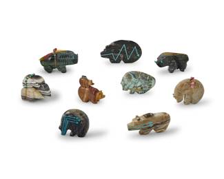 1355 A group of Zuni carved stone fetish animals Mid/late 20th century, mostly Zuni Pueblo Most variously incised with signature, initials, or artist's cipher From artists including Paulette Quam, Stewart Quandelacy, Bernard Laiwakete, and Rodney Laiwakete, each carved from hardstone, three with turquoise heartlines, four mounted with offerings 9 pieces Largest: 2.625" H x 4" W x 1.5" D; Shortest: 1.875" H x 3.75" W x 0.75" D Estimate: $300 - $500
