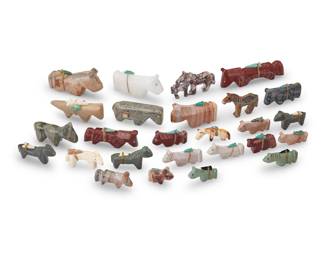 1365 A group of Southwest Pueblo carved stone horse fetish figures Mid/late 20th century, mostly Zuni Pueblo Six labeled for artist; one labeled: Martinez A group of carved stone figures, primarily horses, in various sizes and various stones and materials including pipestone, bone, and other pink, grey, and green hardstones, including six figures by Zuni artists including Emery Boone, Gabriel Burns, and Jessie Le Boeuf as well as twenty further figures, most with mounted offerings 26 pieces Largest: 0.875" H x 0.5" W x 3" D; Smallest: 0.375" H x 0.25" W x 0.875" D Estimate: $200 - $400