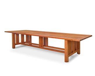 1290 A large Arts & Crafts style cherrywood dining table Late 20th/early 21st century Unmarked With spindle trestle supports joined by a double-beam H-stretcher with central spindle accents 30" H x 134.25" W x 48.25" D Estimate: $1,000 - $2,000