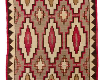 1161 A large room sized Navajo regional rug Early/mid-20th century, Diné Woven in red, cream, natural grey, dark brown, and tan, with stacked and floating stepped diamonds 14' 10" H x 8' 10" W Estimate: $2,000 - $4,000