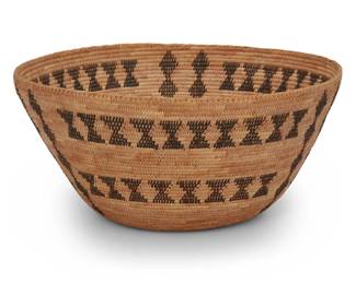 1051 A Western Mono basketry bowl Early 20th century; Central California A large tapered coiled bowl of bracken fern, saw grass, and willow, with two rows of triangular banding and three columns of stacked diamonds 6.5" H x 13.5" Dia. Estimate: $1,000 - $2,000