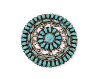 1353 A Larry Moses Begay Navajo sterling silver and turquoise pendant/brooch Larry Moses Begay (b. 20th century, Diné) Late 20th century Stamped: LMB / Navajo / Sterling / USA The round brooch/pendant with petit point cluster-set edging and center, with a central openwork band 2.5" Dia. 25.1 grams gross Estimate: $200 - $400