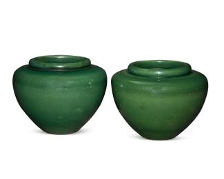 1263 A pair of Pacific green glazed pottery planters Early/mid-20th century One incised to underside: 109 2 pieces Each: 14.375" H x 19" Dia. Estimate: $400 - $600