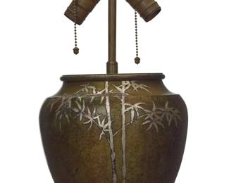 1257 A Heintz Art Metal Shop silver overlay lamp base Early 20th century Impressed factory mark and: STERLING / ON BRONZE / PAT. AUG 27, 12 / 5505 B The verdigris patinated bronze base with silver overlay bamboo issuing two Leviton lights, electrified 15" H x 8.125" Dia. Estimate: $500 - $700