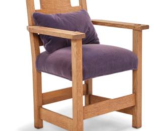 1292 A Limbert oak cutout armchair Early 20th century With shop burn mark underneath one arm Similar construction to model no. 594, but without rockers, the seat later reupholstered in purple mohair 35.75" H x 24.5" W x 23" D Estimate: $400 - $600