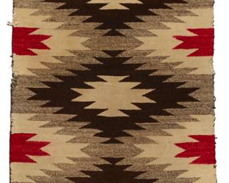 1234 A Navajo regional rug Early 20th century, Diné Woven in red, cream, dark brown, and natural grey wool, with stacked serrated diamonds 55" H x 31.5" W Estimate: $200 - $300