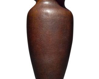 1178 Albert Berry (1878-1949) A hammered copper vase, early 20th century Impressed to underside: BERRYS' CRAFTSHOP / THEIR MARK / [cipher] / SEATTLE The shouldered ovoid vase with a shaped flared rim 10.25" H x 4.375" Dia. Estimate: $600 - $900