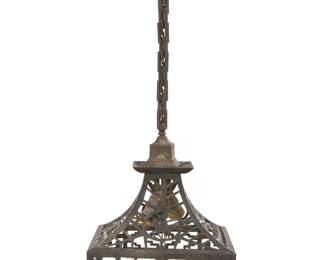 1226 An Arts & Crafts pendant lamp Early 20th century With two lights and reticulated brass shade depicting Southwest/Native American themes to each panel and skirt, designed for slumped/slag glass or mica, electrified 34.5" H x 10.25" W x 10.25" D Estimate: $600 - $800