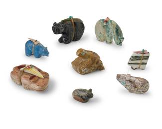 1354 A group of Zuni carved stone fetish animals Mid/late 20th century, mostly Zuni Pueblo Most variously incised with signature, initials, or artist's cipher From artists including Gibbs Otho, Joseph Begay, Anderson Weahkee, Michael Coble, and Daphne Quam, each carved from hardstone, one with turquoise heartline, each with inset turquoise, jet, or coral eyes, five mounted with offerings 8 pieces Tallest: 3" H x 4.125" W x 1.625" D; Smallest: 1.25" H x 2" W x 1.125" D Estimate: $700 - $900