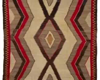 1162 A large room sized Navajo regional rug Early/mid-20th century, Diné Woven in red, cream, natural grey and dark brown wool, with stacked serrated diamonds within a sawtooth border 12' 10" H x 8' 3" W Estimate: $1,000 - $2,000