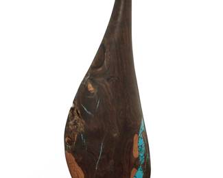 1386 Lawrence Favorite (b. 20th century) An ironwood and turquoise vase, late 20th century Incised signature to underside: L. Favorite With in-filling and inlaid turquoise elements 16.75" H x 5.625" W x 2.625" D Estimate: $200 - $400