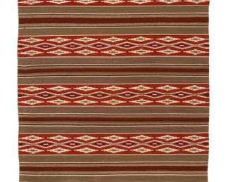 1241 A Blanche Hale Navajo Wide Ruins textile Late 20th century, Diné Woven in a fine tapestry weave with vegetal-dyed wool in red, brown, orange, and cream, with alternating bands of serrated diamonds and striped banding 50" H x 36" W Estimate: $500 - $700
