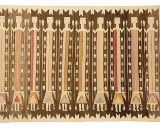 1232 A Navajo Yei textile Mid-20th century, Diné Woven in cream, dark brown, and multicolored wool, depicting ten figures each holding feathers 58.5" H x 88.5" W Estimate: $500 - $700