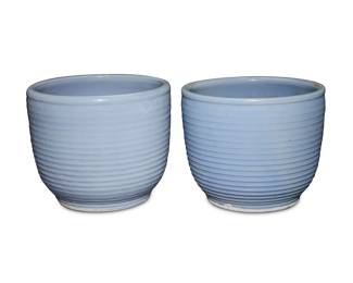 1014 A near pair of Bauer blue glazed pottery ringware planters Circa 1930s One marked: 11 2 pieces Taller: 13.75" H x 17" Dia.; Shorter: 13.25" H x 16.5" Dia. Estimate: $500 - $700