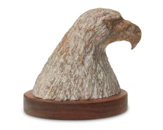 1392 Robert Dale Tsosie (b. 1960, Navajo/Diné) Eagle head Carved stone on wood plinth Incised signature: R D / TSOSIE 4.25" H x 5" W x 4.375" D Estimate: $100 - $200