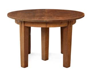 1173 An Arts & Crafts extension dining table Early 20th century Appears unmarked Likely L. & J.G. Stickley no. 718 with 44" diameter top, the circular table with four extension leaves, each housed in original fitted case Circular: 28.5" H x 44.25" Dia.; Each leaf: 13.25" W Estimate: $1,500 - $2,000