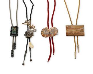 1366 A group of Southwest style bolo ties Late 20th century Each unmarked Four works comprising a rectangular picture jasper bolo tie on a gold-tone mesh cord with metal tips (34.5" L), and a fossilized double ammonite bolo with a red braided cord (35" L), as well as a modernist-style sterling silver slide with set boulder opal on a silver-tone mesh cord (32" L), and a heavy sculptural sterling silver stag bolo with gilt-tone antlers, on a braided black leather cord with silver tips and a bone accent (38" L) 4 pieces Bolo slides: 3" H to 1.75" H 325.3 grams gross Estimate: $200 - $400