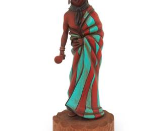 1205 Jonathan Day Sr. (Laguna Pueblo/Hopi-Tewa) A painted carved cottonwood robed mudhead katsina, 1990 Signed and dated to underside: Jonathan Day / "93" The Toson Koyemsi figure depicted with rattle Overall: 12.5" H x 4.375" W x 4.75" D Estimate: $400 - $600