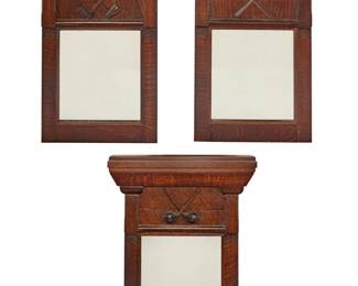 1222 A set of three Improved Order of Red Men carved wood mirrors Early/mid-20th century Each unmarked Each with architectural pediment, one carved with crossed swords, another with crossed mallets, and another with crossed clubs 3 pieces Each: 42" H x 30.5" W x 5.5" D Estimate: $1,000 - $1,500