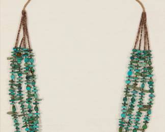 1334 A Navajo multistrand turquoise necklace, attributed to Annie Mae Yellowhorse Annie Mae Yellowhorse (b. 19th century, Diné) Late 19th/early 20th century, Wide Ruins A four-strand fine turquoise and heishi necklace strung to sinew, professionally mounted and framed 31" L approximately Estimate: $600 - $800